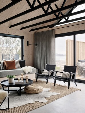 Lakefront Luxury Cabin | Living area | Heated floors, smart speakers - Wander the Resort (Prince Edward)