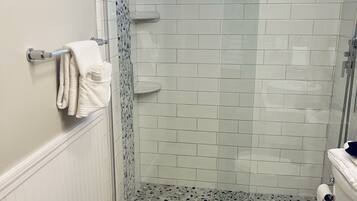 Shower, hair dryer, towels, soap