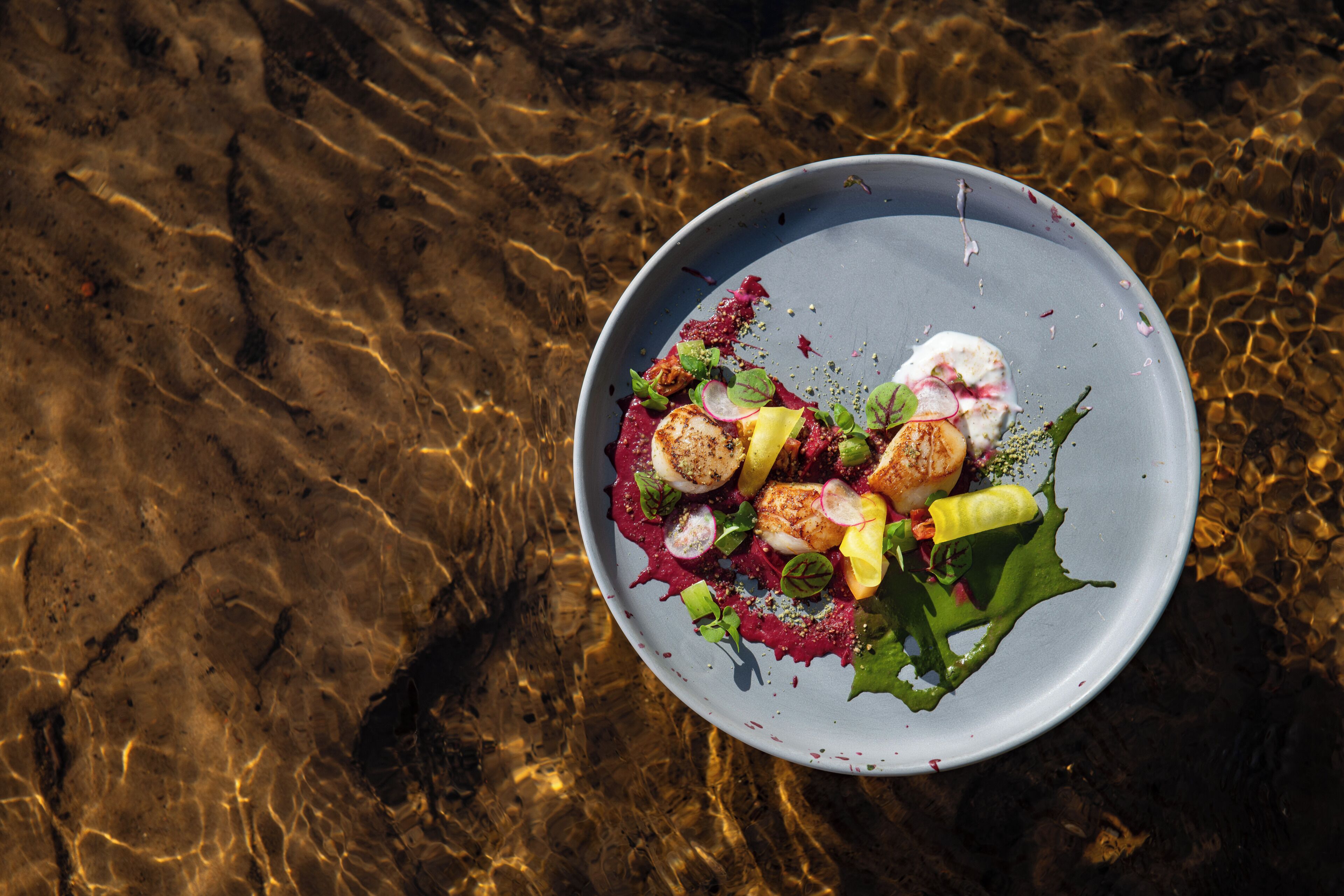 A plate of food with various ingredients on a table.