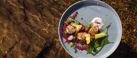 A plate of food with various ingredients on a table.