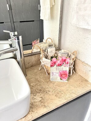 Bathtub, hair dryer, towels, soap