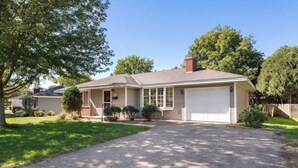 A single-story house with a garage, a front lawn, and a driveway. - Southdale Stinger! Modern 5+BR near it all (Edina)