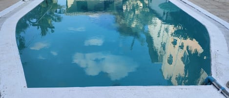 Outdoor pool, open 6:30 AM to 8:00 PM, pool umbrellas