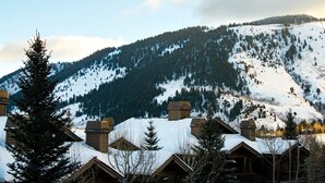 A snow-covered mountain with cabins in the foreground. - Outpost: Grand View 491A (Jackson)
