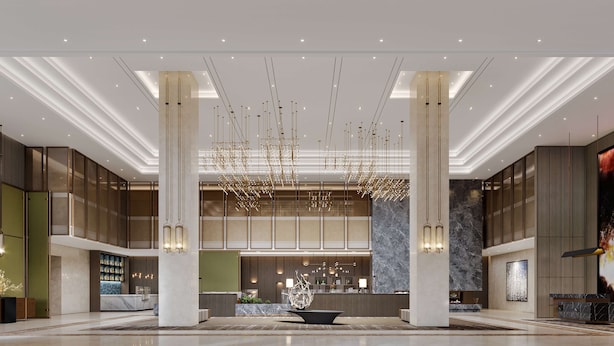 A spacious lobby with a central reception desk, high ceilings, and modern lighting fixtures. - Doubletree By Hilton Anshan (Anshan)