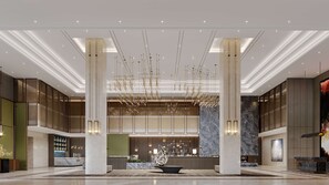 A spacious lobby with a central reception desk, high ceilings, and modern lighting fixtures. - Doubletree By Hilton Anshan (Anshan)