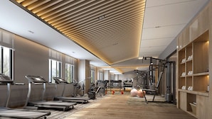 A modern gym with treadmills, weight machines, and exercise balls. - Doubletree By Hilton Anshan (Anshan)