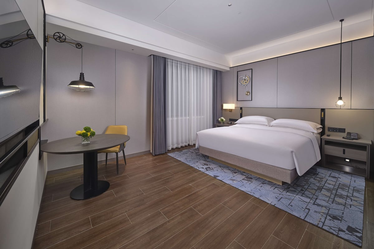 Superior Room, 1 King Bed | Living area | 55-inch LCD TV with cable channels, TV