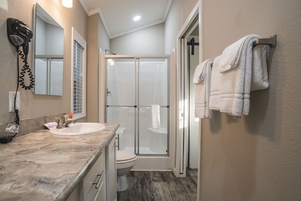 Shower, towels, soap, toilet paper