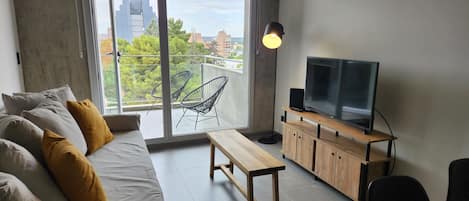 Appartement Deluxe | Coin séjour | Télévision