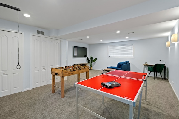 Welcome to the ultimate entertainment oasis in this lower-level living room!