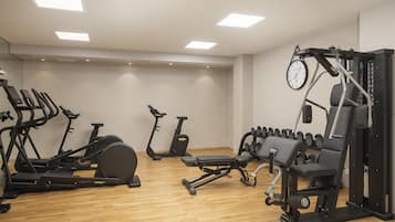 A gym with various exercise equipment including treadmills, stationary bikes, and weight machines.