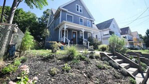 A two-story house with a porch and a small garden area in front. - 191 Seymour, Ave. Derby · Spacious Renovated 3 bedroom near GriffinHospital (Derby)