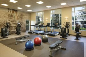 A gym with treadmills, elliptical machines, and free weights. - Orlando | Lakeside Escape | Resort Pool & Theme Parks Nearby (Orlando)