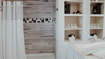 Combined shower/tub, hair dryer, towels, soap