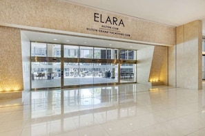 Welcome to the Elara Hilton Club, where a clean design and polished floors set the tone for a relaxing stay.