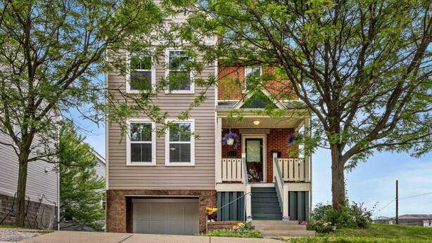 A two-story residential building with a front porch, a garage, and a small balcony. - Skyline Views, Park For Free and Walk To Downtown, PPG, Convention Center (Pittsburgh)