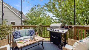 An outdoor patio with a grill, a sofa, and a dining table. - Skyline Views, Park For Free and Walk To Downtown, PPG, Convention Center (Pittsburgh)