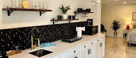 Fridge, microwave, stovetop, coffee/tea maker