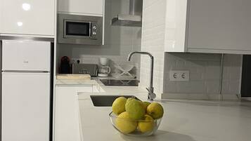 Microwave, stovetop, dishwasher, cookware/dishes/utensils