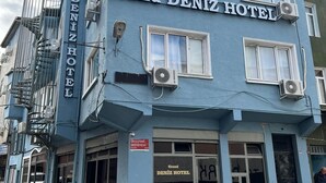 The Grand Deniz Hotel building with a blue facade, multiple windows, and air conditioning units. - GRAND Deniz Hotel (Istanbul)