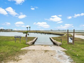A private boat ramp with a sign indicating no public access. - Coastal Charm by Miss Kitty’s (Rockport)