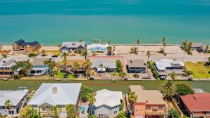 A coastal residential area with houses, a dock, and a beach. - Sea-esta by Miss Kitty’s (Rockport)
