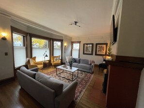 TV, fireplace, books