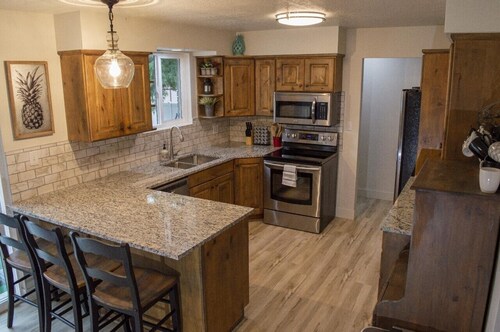 Gorgeous island-themed retreat sleeps 30 in Orem, UT!