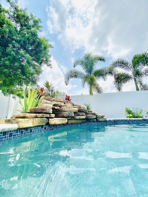 Outdoor pool, a heated pool - 4 bedroom home with heated saltwater pool and hot tub. Close to the beach! (Seminole)