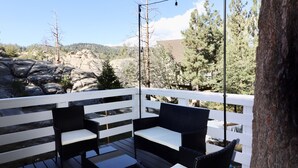 A deck with outdoor furniture and a view of a mountainous landscape. - Romantic Winter Escape with Mountain Views (Running Spring (Arrowbear lake area))