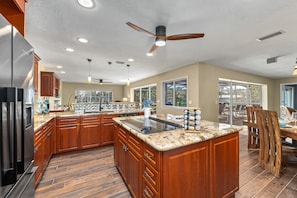 Fridge, microwave, oven, stovetop - Gulf Birdie | Waterfront Home on Siesta Key, w/ Private Heated Pool, Hot Tub, & Putting Green! (Sarasota)