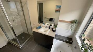 Combined shower/tub, hair dryer, towels, toilet paper