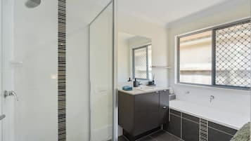 Combined shower/bathtub, hair dryer, towels, toilet paper