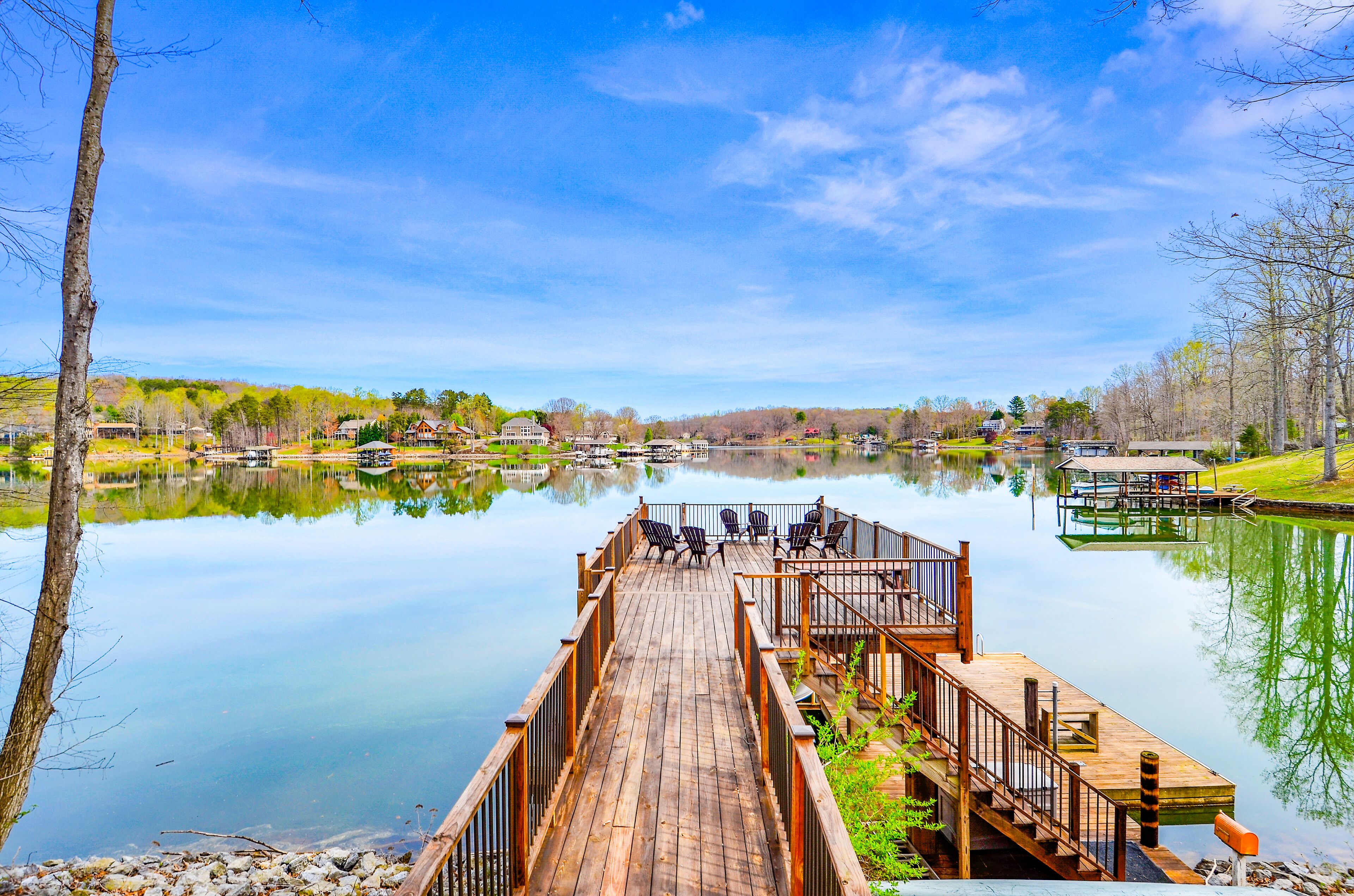 Waterfront lake-view home with dock, fireplace, pool table, kayaks, & firepit