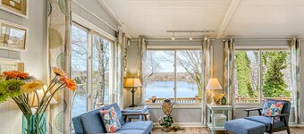 Waterfront lake-view home with dock, fireplace, pool table, kayaks, & firepit