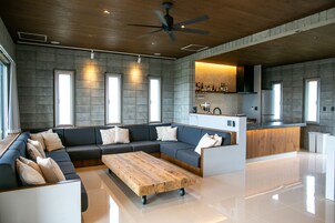 Deluxe Suite | Living area | 42-inch LCD TV with digital channels, TV