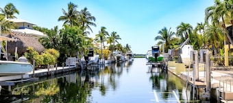 Slice of Paradise: Captivating Open Water Views, Deep Canal, Dockage, Heated Pool, and Pet-Friendly!