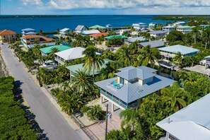Aerial view - Slice of Paradise: Captivating Open Water Views, Deep Canal, Dockage, Heated Pool, and Pet-Friendly! (Big Pine Key)
