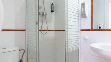 Shower, hair dryer, towels, shampoo