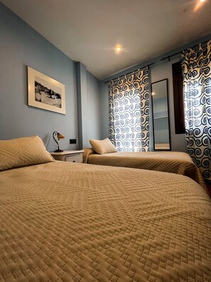 Basic Twin Room, Shared Bathroom | Individually decorated, individually furnished, iron/ironing board
