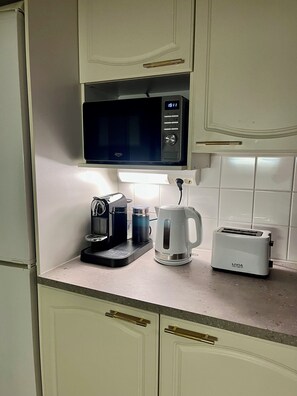 Apartment | Private kitchen | Full-size fridge, oven, stovetop, espresso maker