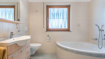 Bathtub, hair dryer, towels