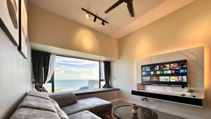 Superior Apartment | Living area | 40-inch flat-screen TV with satellite channels
