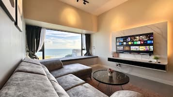 Superior Apartment | Living area | 40-inch flat-screen TV with satellite channels