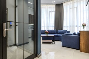 Superior Suite | Living area | 51-inch Smart TV with cable channels, TV