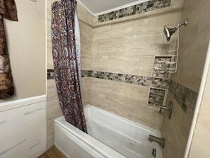 Combined shower/tub, jetted tub