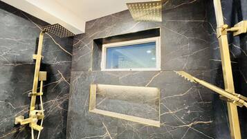 Bathtub, hair dryer, bidet, towels