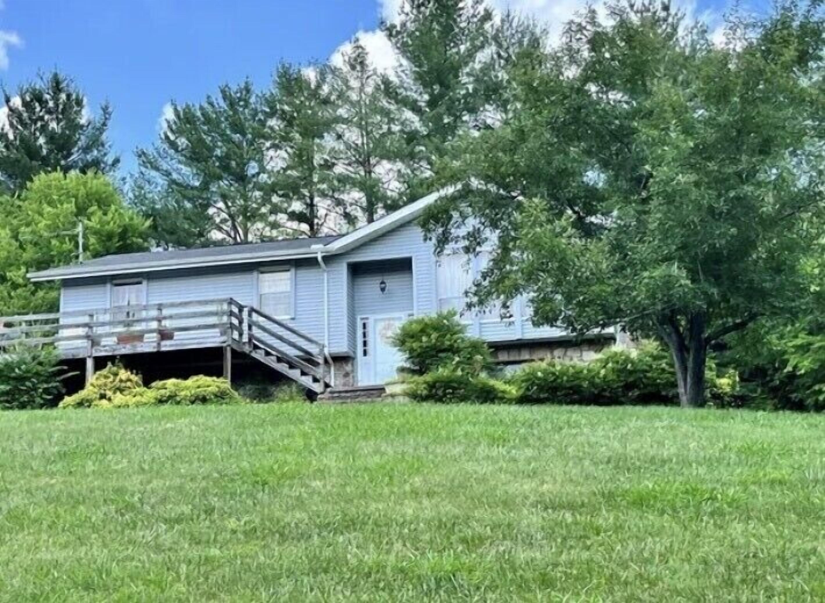 Nestled in the woods above the French Broad River, quite subdivision.