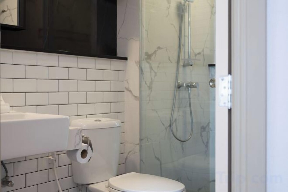 Bathroom | Shower, rainfall showerhead, hair dryer, towels